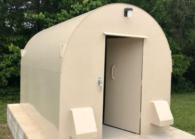 Reinforced steel doors on above ground storm shelters prevent debris penetration and are tested to withstand extreme wind pressures.