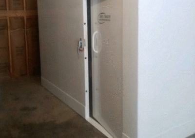 Community storm shelters provide protection for multiple families during tornadoes, located in schools or public buildings.